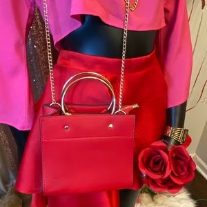 Red crossbody bag with chains